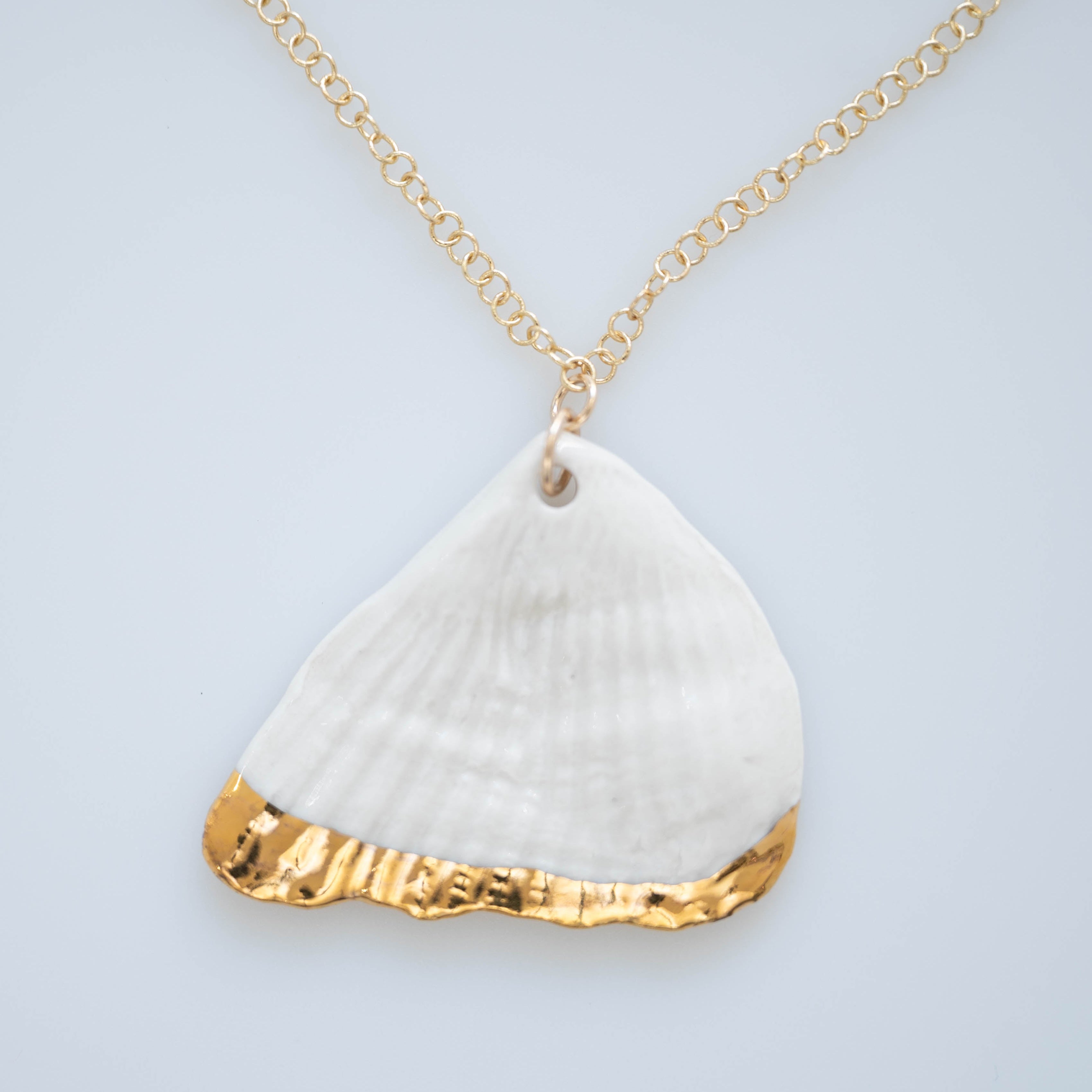 A hand painted porcelain necklace with gold lustre, attached to a gold-filled 18" chain