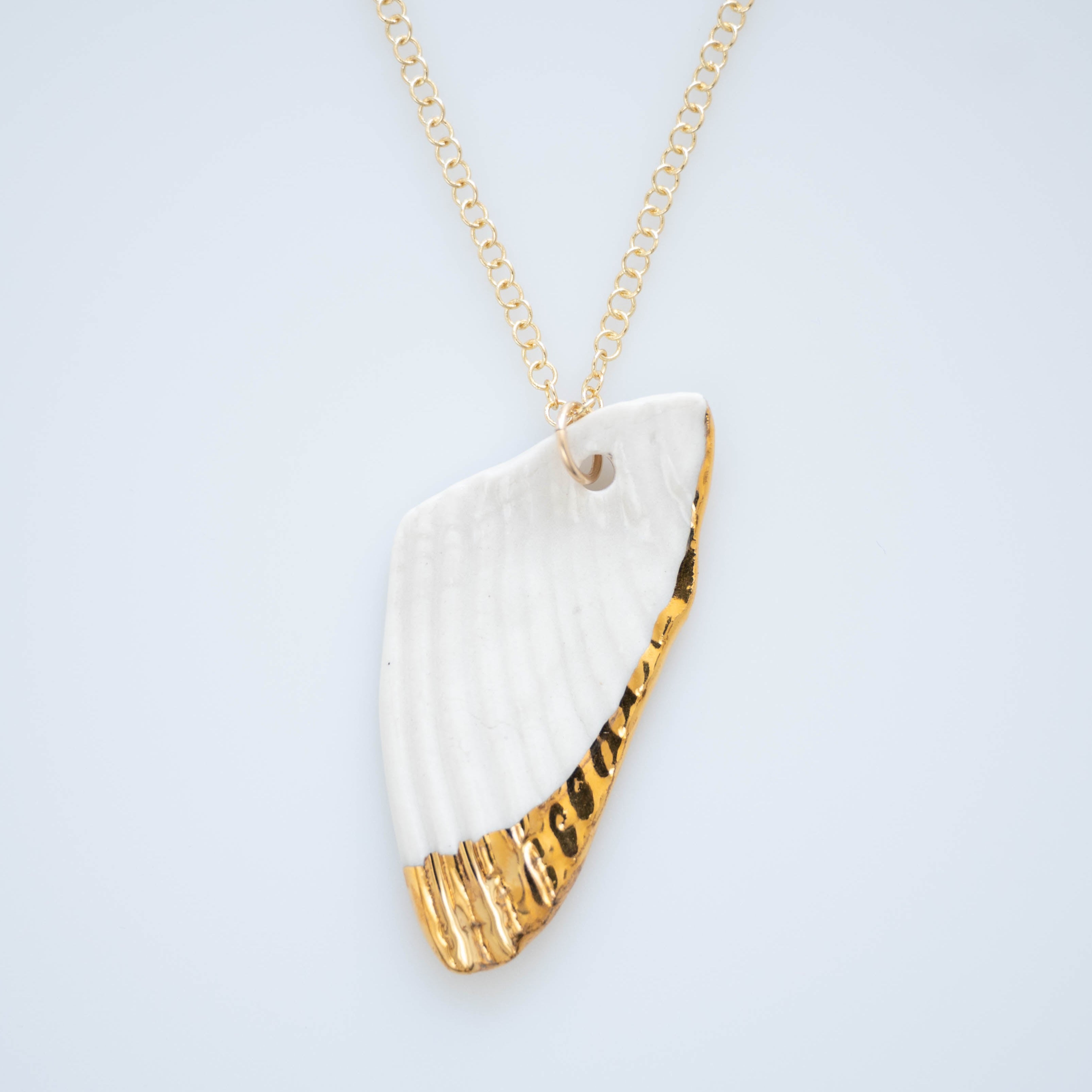 A hand painted porcelain necklace with gold lustre, attached to a gold-filled 18" chain