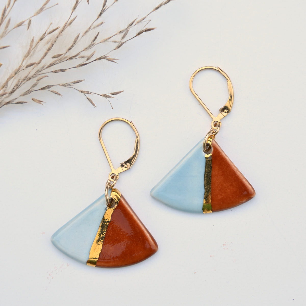 Canyon Sky Color Slice handmade ceramic earrings in blue and rust with gold luster