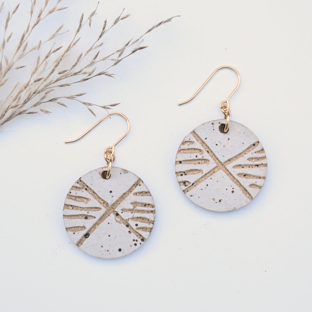 Crossroad handmade speckled clay earrings with hand-carved geometric design by Hudson Ceramics