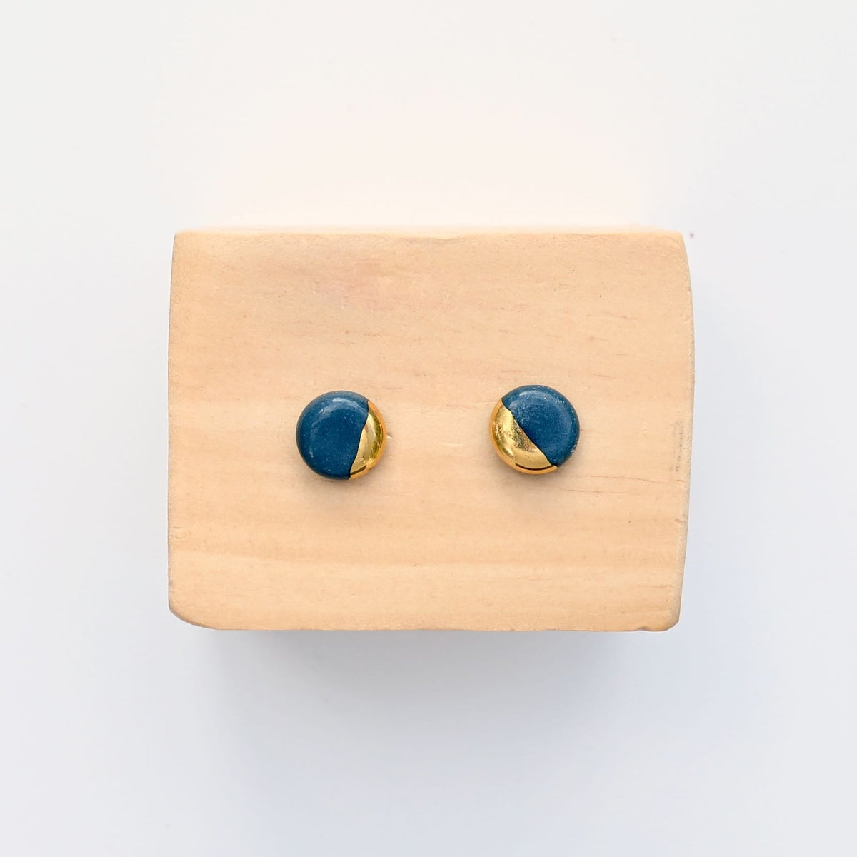 Handmade teal porcelain stud earrings with gold luster by Hudson Ceramics