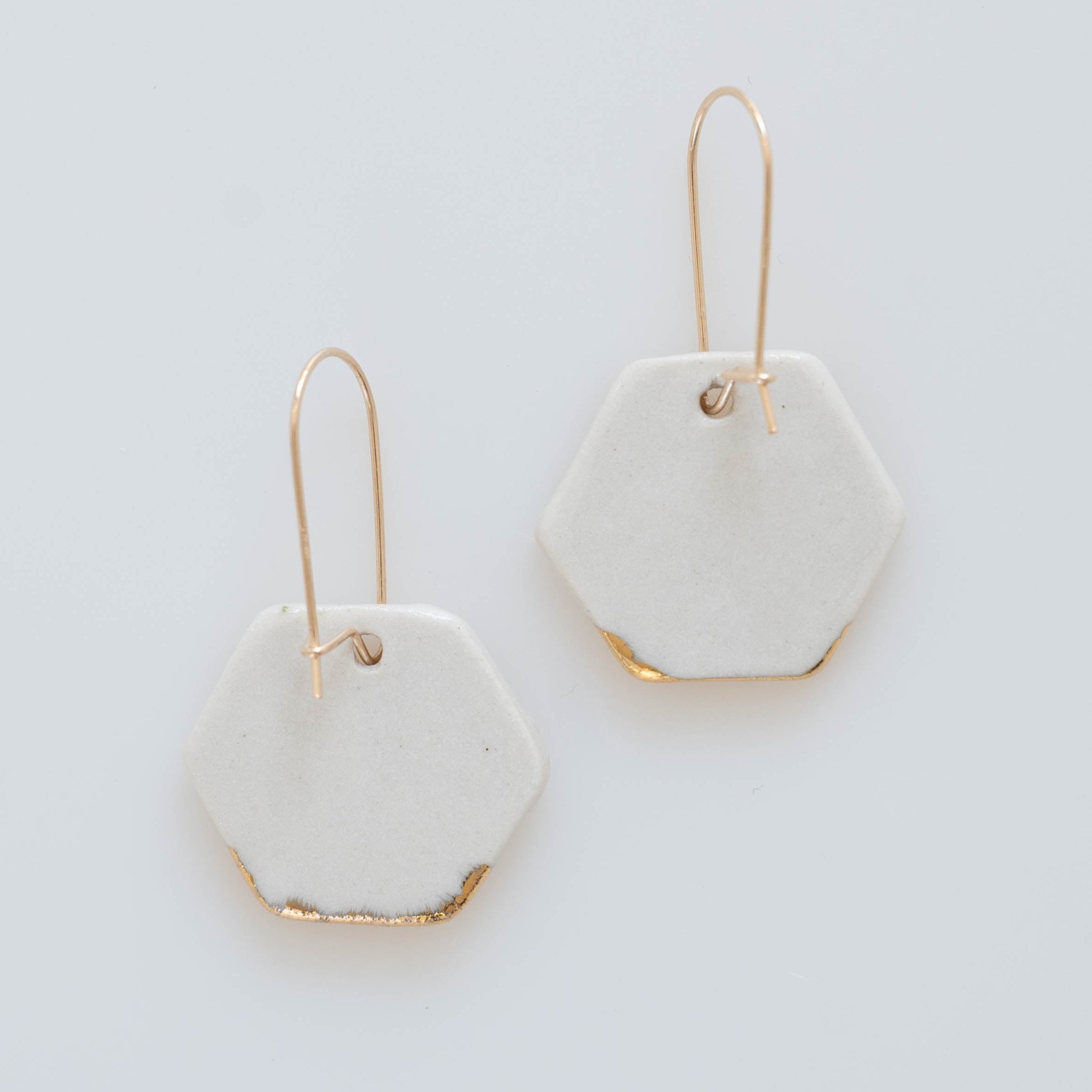 back view of ivory and gold dangle earring