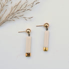Mira handmade porcelain earrings with modern slender drops and genuine gold luster by Hudson Ceramics.