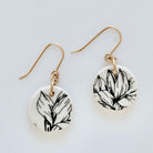 Handmade black and white porcelain Magnolia drop earrings with botanical floral design and gold-filled ear wires by Hudson Ceramics