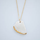 A hand painted porcelain necklace with gold lustre, attached to a gold-filled 18" chain.